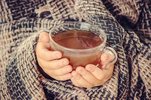 A cup of tea and a cozy autumn background. Selective focus. food.