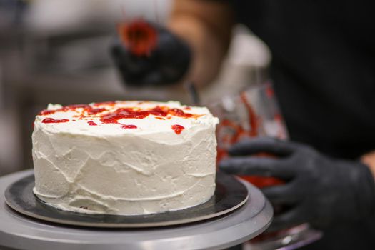 Bleeding monster cake with knife on cake stand