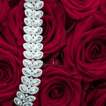 Luxe branding, glamour fashion and boutique shopping concept - Luxury diamond jewelry bracelet and red roses flowers, love gift on Valentines Day and jewellery brand holiday background design