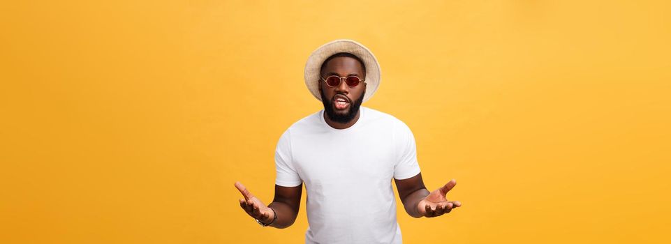 Young african american man wearing white t-shirt shouting and screaming loud to side with hand on mouth. Communication concept