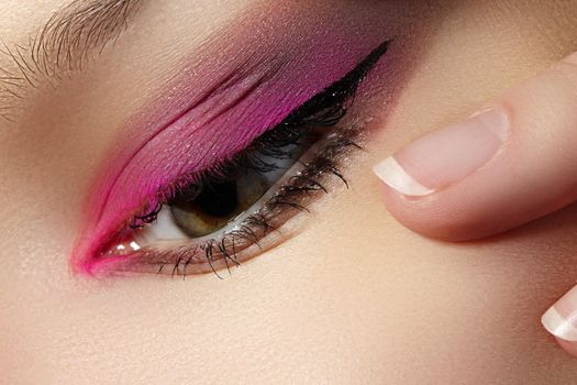 Closeup Macro of Woman Face with Pink Eyes Make-up. Fashion Celebrate Makeup, Glowy Clean Skin. Beautiful Bright Magenta Red Make-up