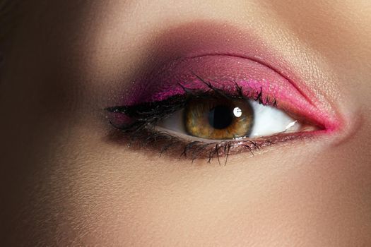 Closeup Macro of Woman Face with Pink Eyes Make-up. Fashion Celebrate Makeup, Glowy Clean Skin. Beautiful Bright Magenta Red Make-up