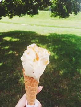 Delicious gelato, organic dairy and homemade recipe concept - Ice cream cone melting outdoors in summer, sweet dessert food on holiday