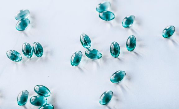 Pharmaceutical, branding and science concept - Blue pills for healthy diet nutrition, supplements pill and probiotics capsules, healthcare and medicine as pharmacy and scientific research background