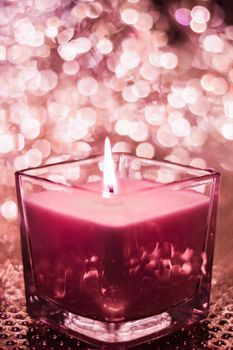 Festive decoration, branding and aromatherapy spa concept - Red aromatic candle on Christmas and New Years glitter background, Valentines Day luxury home decor and holiday season brand design