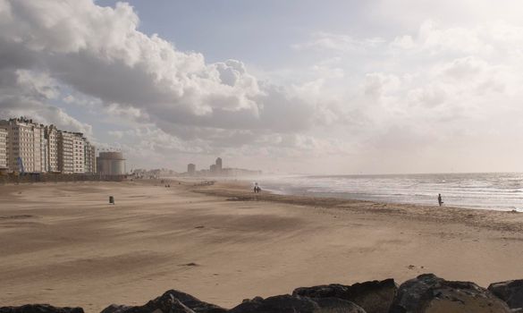 landscape, sandy beach by the north sea, shadows on the sand from clouds in the beautiful sky. High quality photo