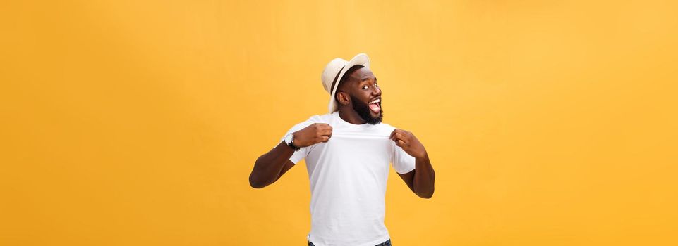 Handsome young Afro-American man employee feeling excited, gesturing actively, keeping fists clenched, exclaiming joyfully with mouth wide opened, happy with good luck or promotion at work.