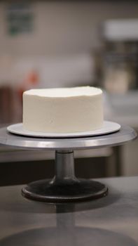 white cake without decor on a stand