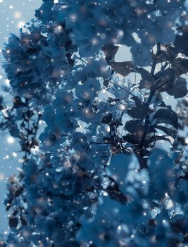 Magical, branding and festive concept - Christmas, New Years blue floral nature background, holiday card design, flower tree and snow glitter as winter season sale backdrop for luxury beauty brand