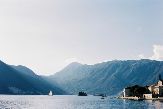 Island of St. George near the coast of Perast with mountains in the background. High quality photo