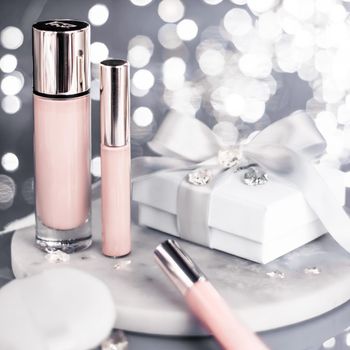 Cosmetic branding, Christmas glitter and girly blog concept - Holiday make-up foundation base, concealer and white gift box, luxury cosmetics present and blank label products for beauty brand design