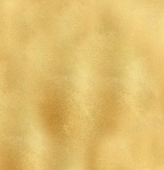 Rough abstract mottled surface of golden yellow color.Texture or background