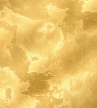 Rough mottled surface of golden yellow color close-up.Texture or background