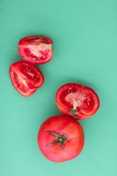 Plant based diet, vegetarian recipe and farm garden concept - Fresh ripe red tomatoes on green background, organic vegetable food