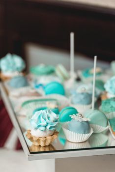 Sweet almond colorful tiffany colored blue macaron or macaroon dessert cake. French sweet cookie. Minimal food bakery concept.