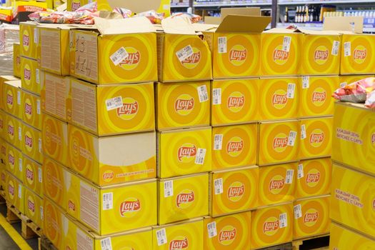 Tyumen, Russia-September 27, 2022: Lays a popular brand of potato chips on display at an sale in a supermarket.