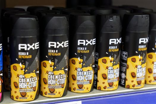 Tyumen, Russia-June 30, 2022: Spray of Axe deodorant skin and cookies on the shelves of the hypermarket. Local department store