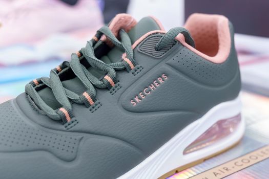 Tyumen, Russia-August 12, 2022: New men sneakers logo white los angeles by Skechers. Selective focus
