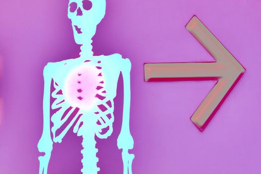 the night of October 31, the eve of All Saints' Day, commonly celebrated by children who dress in costume . Halloween blue funny skeleton with an arrow the direction on a pink