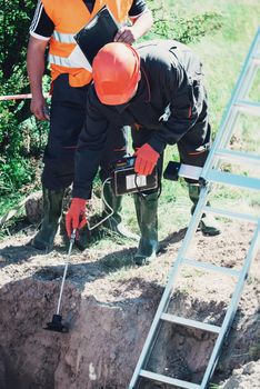 Mechanical engineer checking and inspect gas concentration in a place of possible outflow. maintenance services.