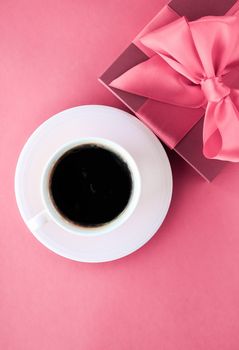 French chic, Valentines Day present and beauty drink concept - Luxury gift box and coffee cup on pink background, flatlay design for romantic holiday morning surprise