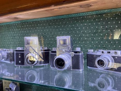 Tyumen, Russia-July 28, 2022: Old retro cameras, an exhibition of old photo accessories. The history of photography