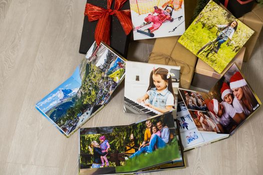 photobooks near the New Year tree, colored as a gift for the holiday