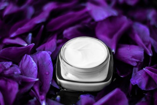 Cosmetic branding, moisturizing and anti-age - Luxury face cream moisturizer for facial skin on purple flower background, floral essense, spa cosmetics and beauty emulsion for skincare brand product