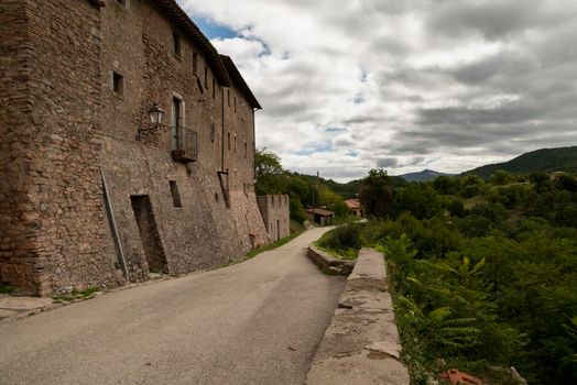 outside the walls of the town of Macerino, a historic stone town inhabited only in summer