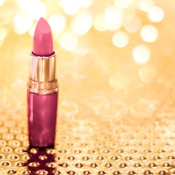 Cosmetic branding, sale and glamour concept - Rose lipstick on golden Christmas, New Years and Valentines Day holiday glitter background, make-up and cosmetics product for luxury beauty brand