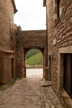 door arch of exit of the town of Macerino historic town entirely in stone inhabited only in summer