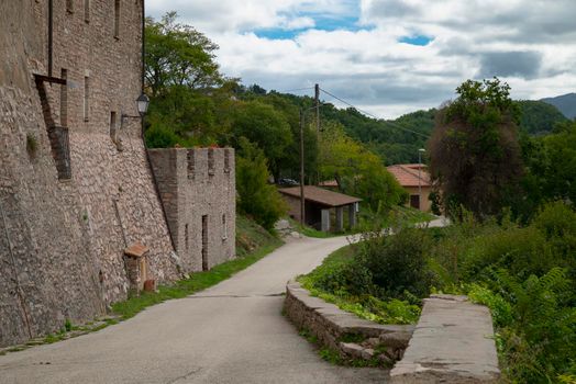 outside the walls of the town of Macerino, a historic stone town inhabited only in summer