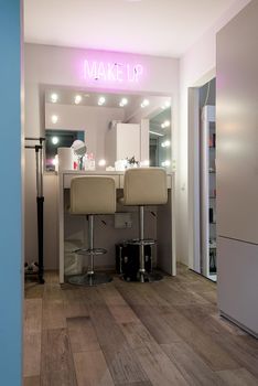 Workplace makeup artist. Barbershop. professional mirror with lamps on sides