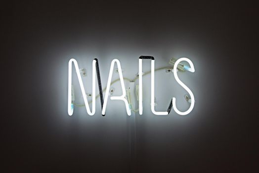 Shining Nails white Neon Label. advertising for a beauty salon