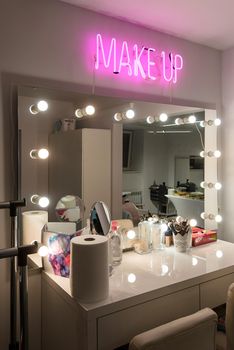 Workplace makeup artist. Barbershop. professional mirror with lamps on sides