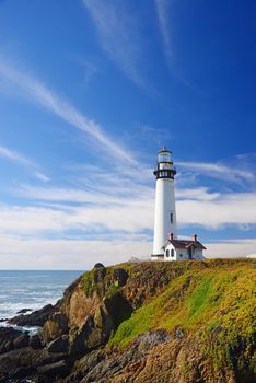 white pigeon point lighthouse with a blue sky in a sunny day