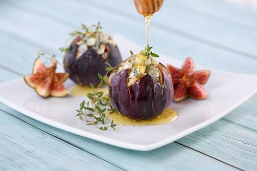 Figs stuffed with blue cheese and thyme, seasoned with honey