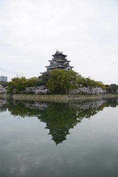 hiroshima castle with cherry blossom