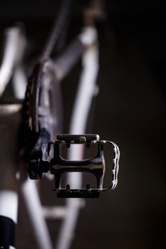Black metal pedal on a bike with hard light. Bike accessories
