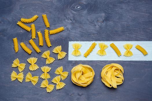Pasta with durum wheat. Food for vegans. Proper nutrition, healthy food. Gray background