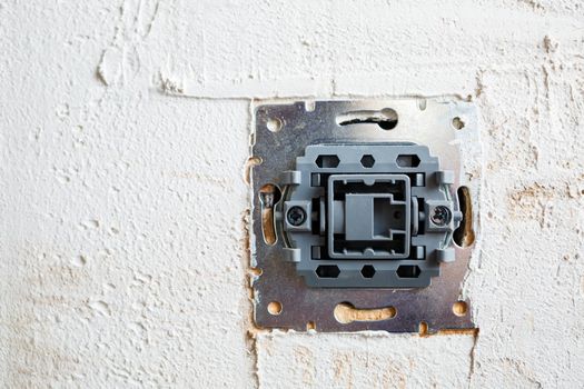 Sockets when mounted without a cover. During repair. open the wires. European nest without cover isolated on a white background. Professional installation of electrical outlets