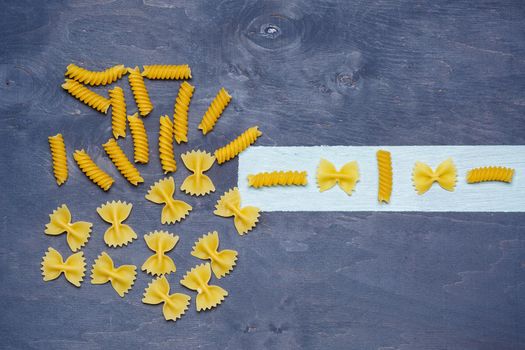 Pasta with durum wheat. Food for vegans. Proper nutrition, healthy food. Gray background