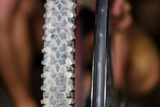 A man changes the camera on a bicycle wheel. Spike Bike Chamber