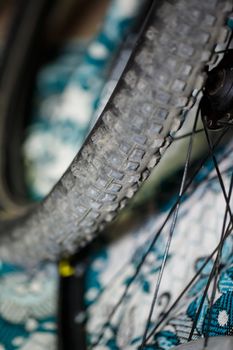 A man changes the camera on a bicycle wheel. Spike Bike Chamber
