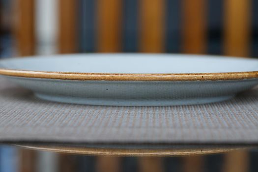 Empty plate of blue glaze ceramic melamine for dinner.