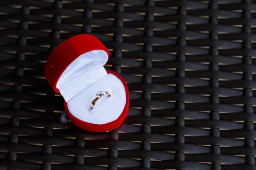Engagement gold precious jewelry ring for a girl in a red box