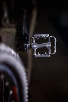 Black metal pedal on a bike with hard light. Bike accessories