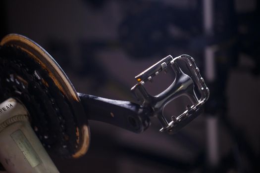 Black metal pedal on a bike with hard light. Bike accessories