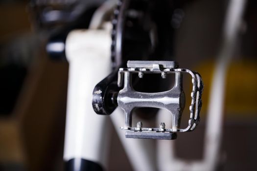 Black metal pedal on a bike with hard light. Bike accessories
