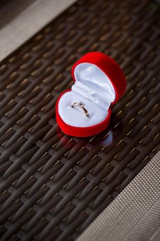 Engagement gold precious jewelry ring for a girl in a red box